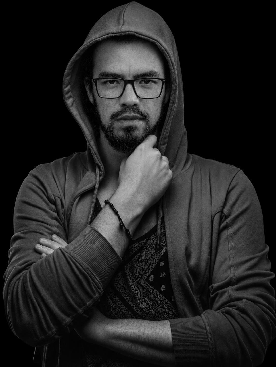 Black-and-white studio portrait of Alejandro Barquera in a hoodie