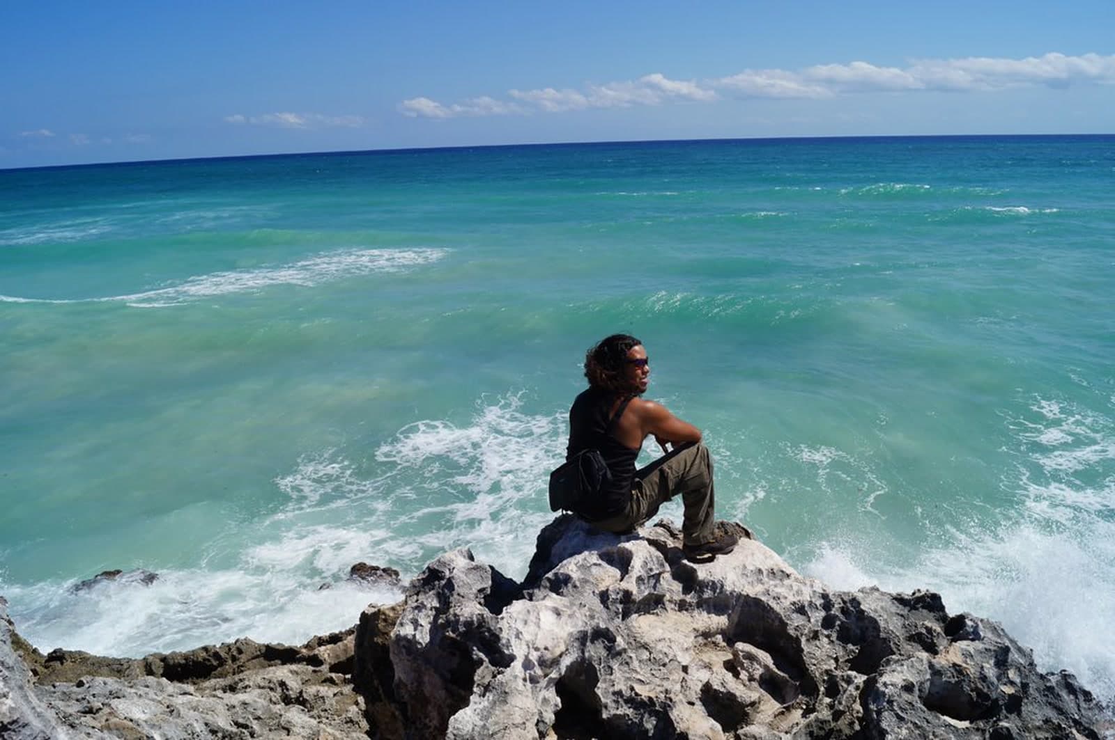 Sitting on a sea cliff, watching the swell